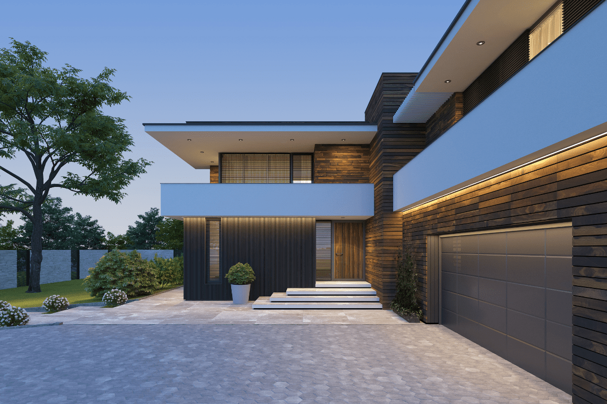 Modern house exterior with evening lighting.